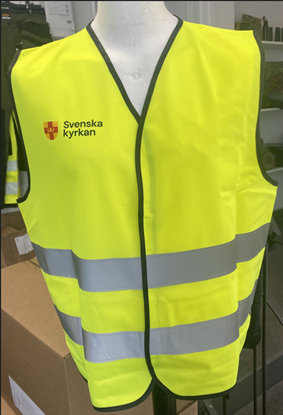 Bild på Väst med reflexband. Svenska kyrkan. Nya logotypen